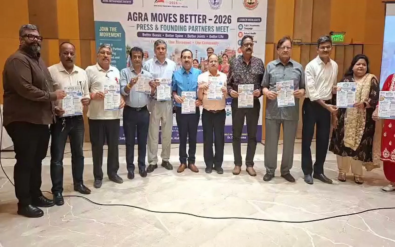 Founding partners and AOS representatives holding Agra Moves Better 2026 campaign material