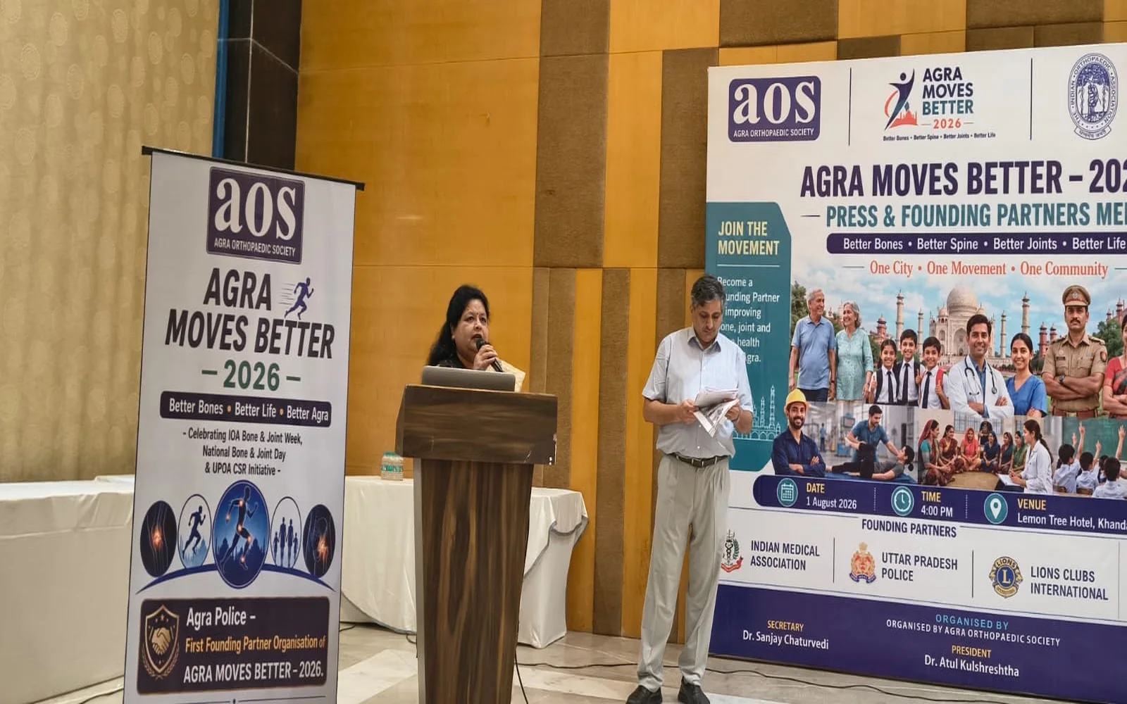 A speaker addressing the Agra Moves Better 2026 Media NGO and Founding Partners Meet
