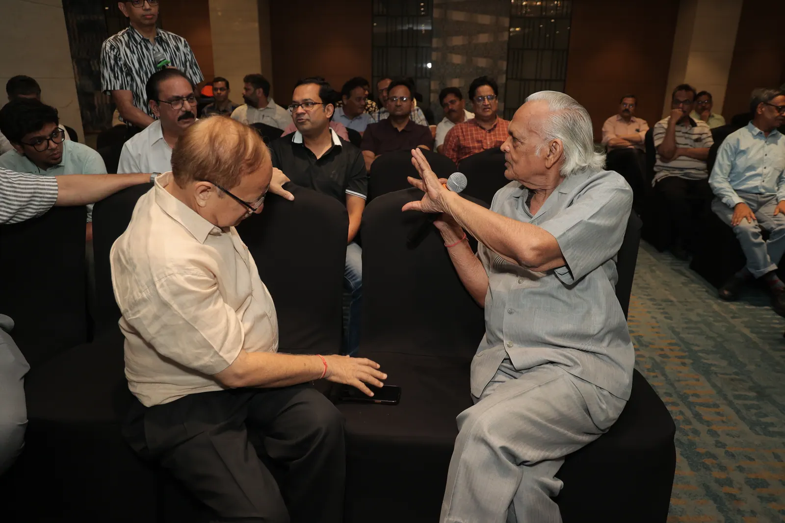 AOS members in conversation during the General Body Meeting