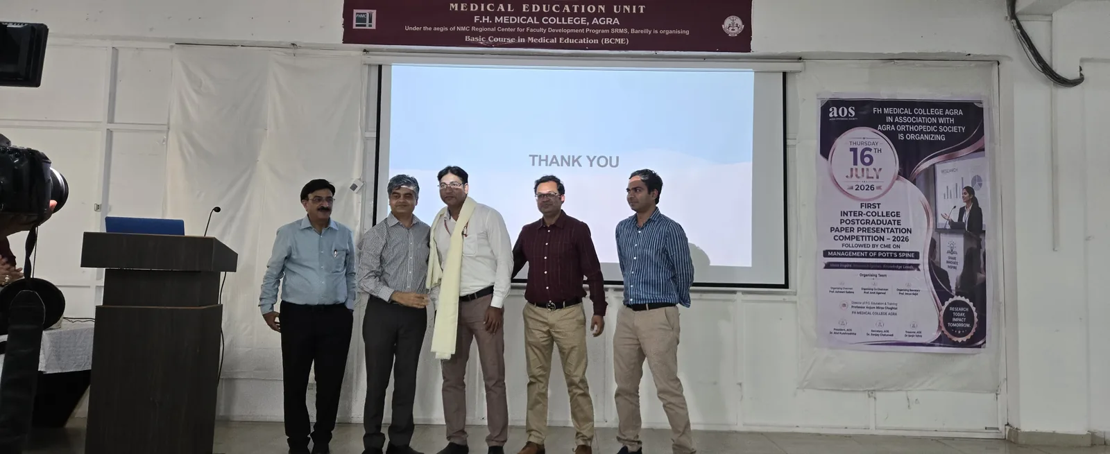 Participants and faculty on stage during the AOS PG paper presentation competition